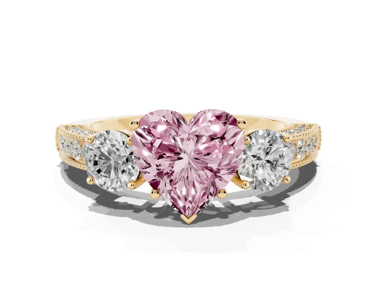 Fancy Pink Heart Cut Three-Stone Diamond Ring with Pavé Band and Four-Prong Setting Yellow gold