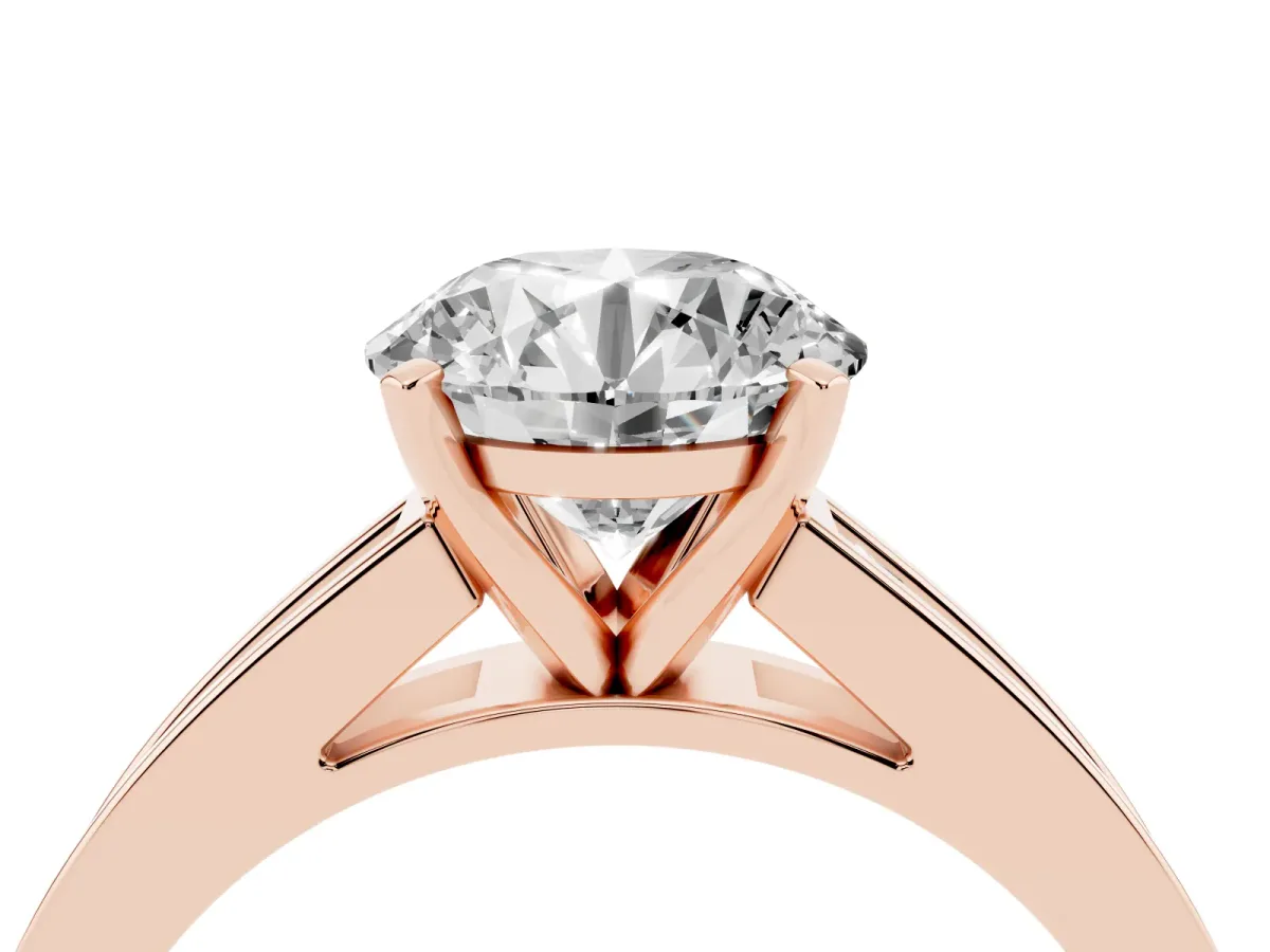 Round Cut Solitaire Diamond Ring with Channel-Set Band and Four-Prong Setting Rose gold