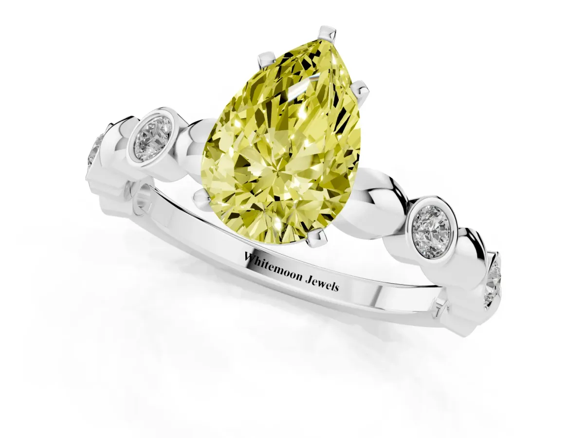 Fancy Yellow Pear Cut Solitaire Bezel-Set Diamond Ring with Beaded Band and Four-Prong Setting Silver