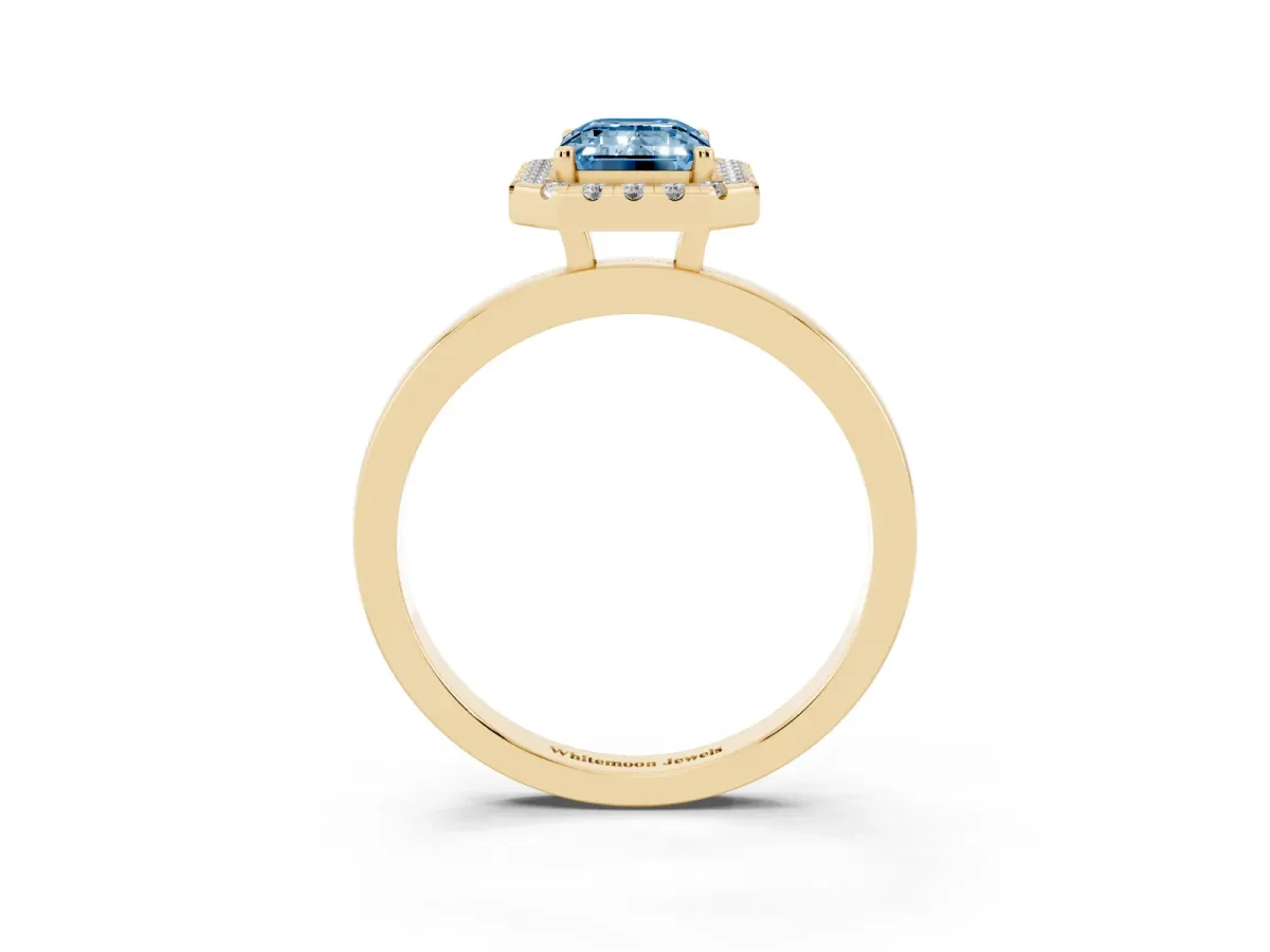 Fancy Blue Emerald Cut Halo Diamond Solitaire with Pavé Band and Four-Prong Setting Yellow gold