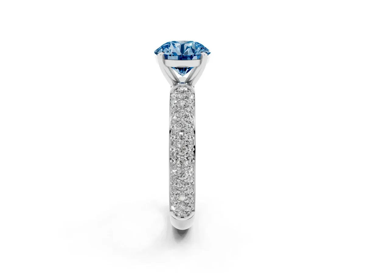 Fancy Blue Round Cut Diamond Solitaire Ring with Prong Setting and Pavé Band Platinum
