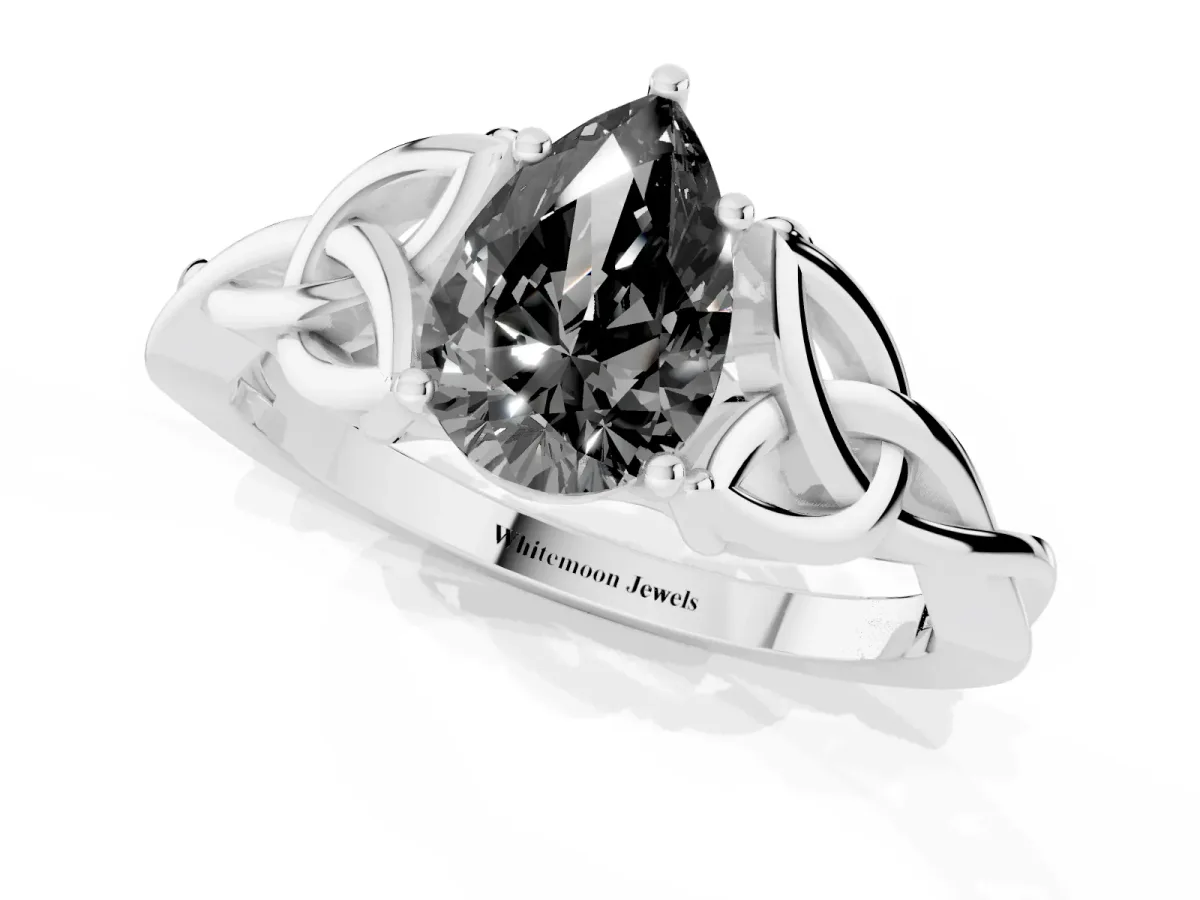Fancy Black Pear Cut Diamond Solitaire Engagement Ring with Celtic Knot Band and Four-Prong Setting Silver