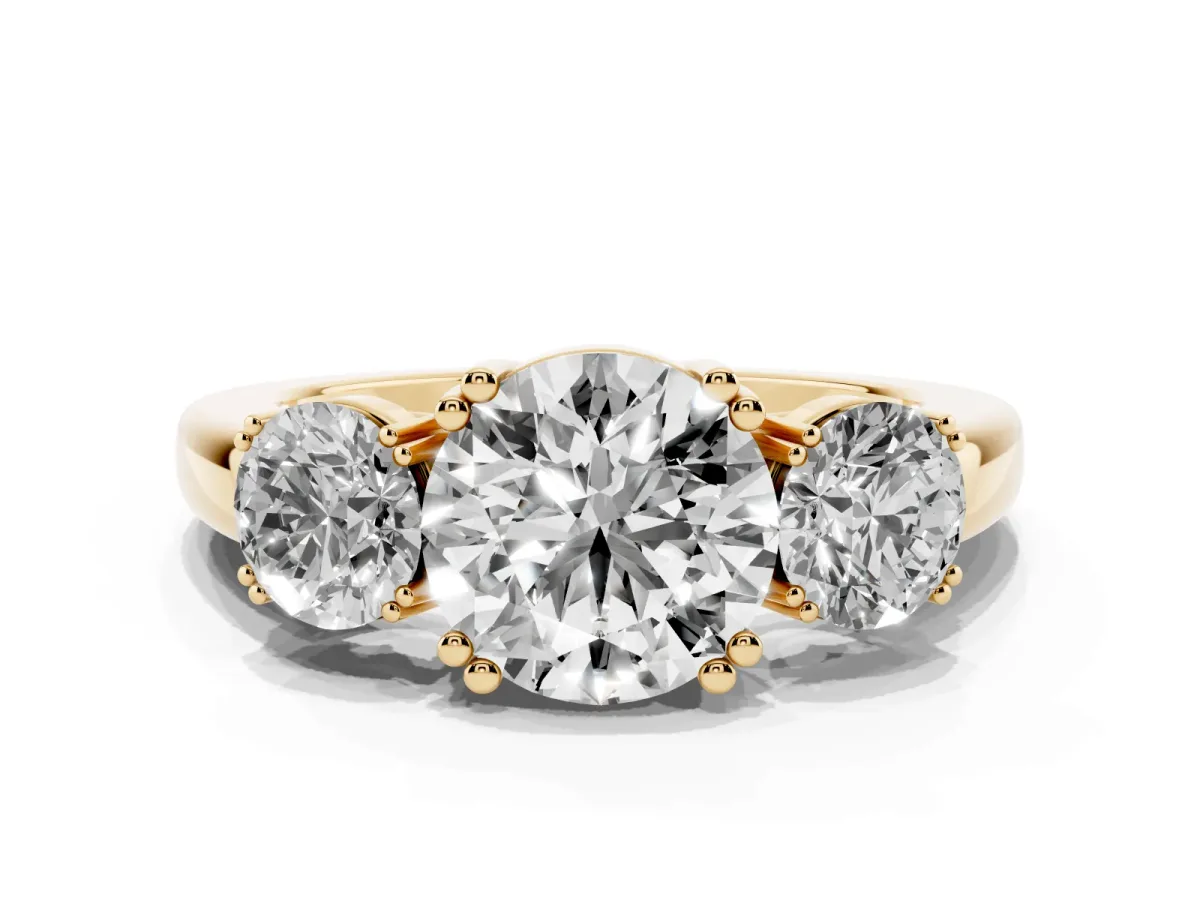 Three-Stone Round Cut Cut Diamond Ring with Channel Set Band and Four-Prong Setting Yellow gold