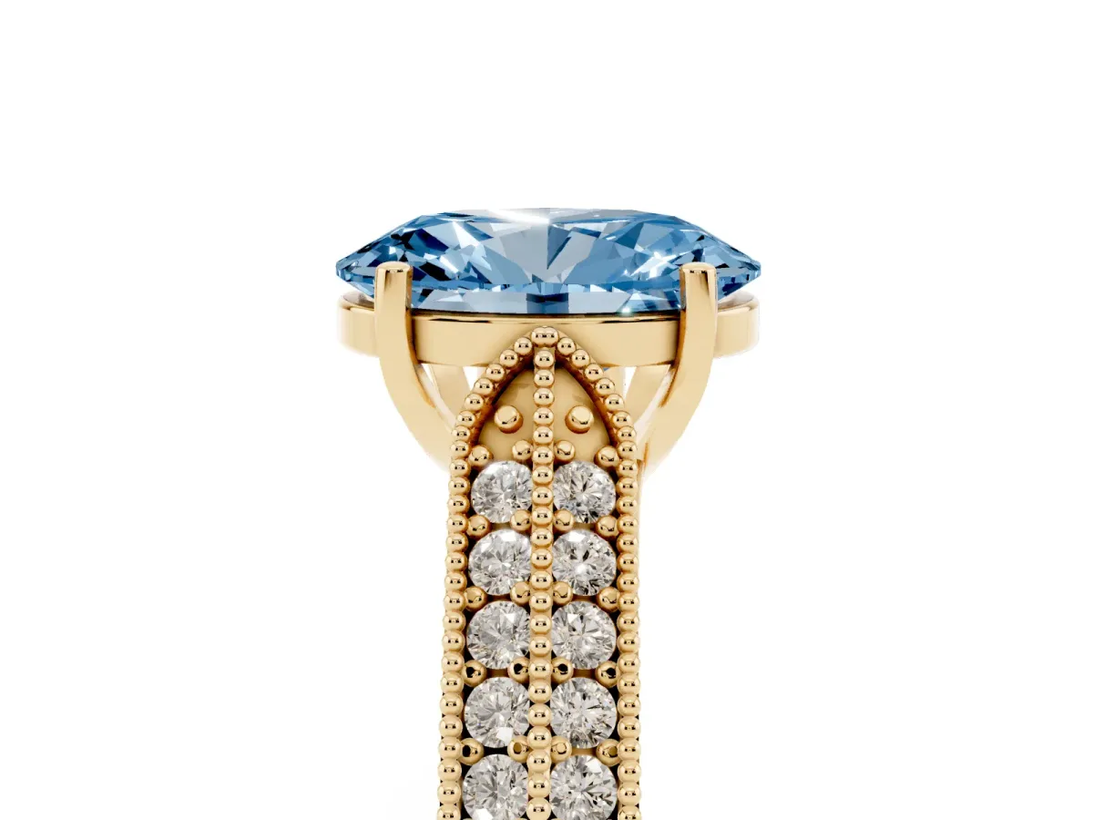 Fancy Blue Oval Cut Cut Pave Split Shank Engagement Ring with Four-Prong Setting Yellow gold