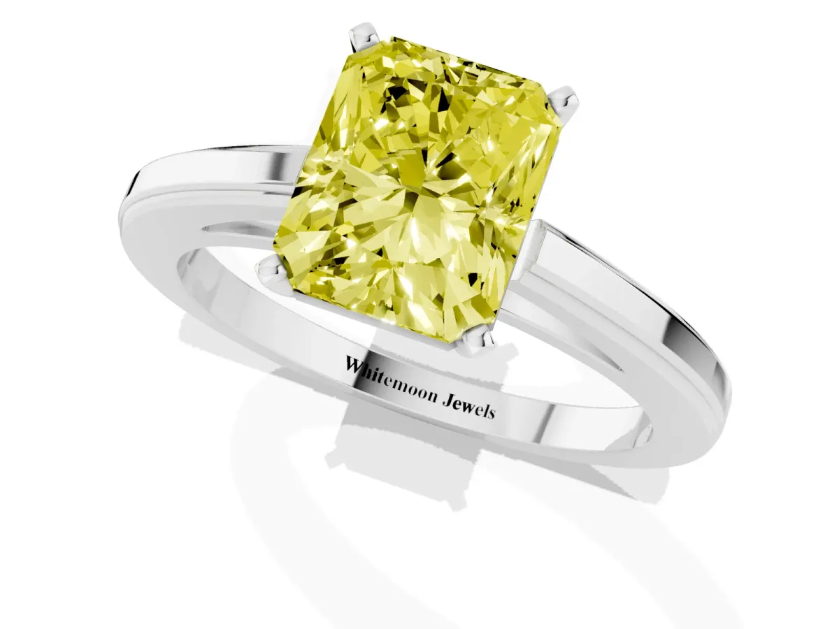 Fancy Yellow Radiant Cut Solitaire Diamond Ring with Four-Prong Setting and Classic Band Silver