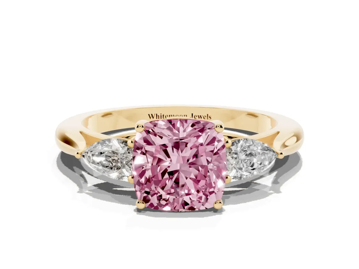 Fancy Pink Three-Stone Cushion Cut Brilliant Diamond Solitaire Ring with Tapered Band and Four-Prong Setting Yellow gold