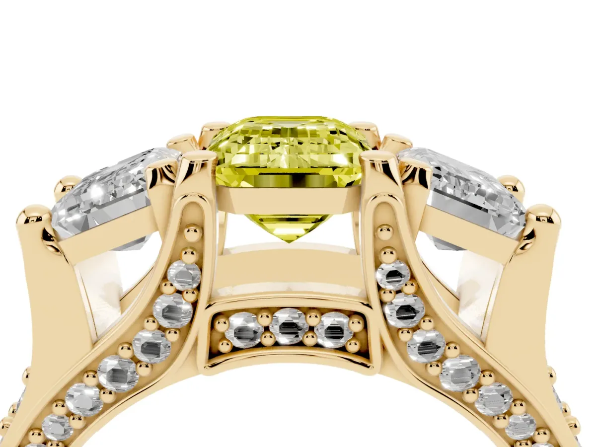 Fancy Yellow Emerald Cut Diamond Three-Stone Ring with Channel Set Band and Four-Prong Setting Yellow gold