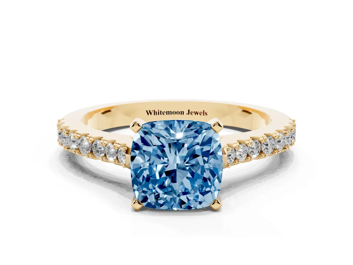 Fancy Blue Cushion Cut Cut Solitaire Diamond Engagement Ring with Pave Band and Four-Prong Setting Yellow gold