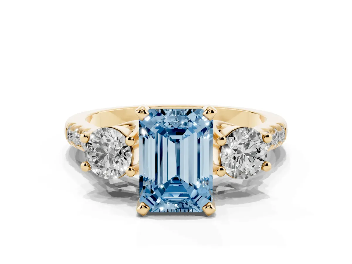 Fancy Blue Three-Stone Emerald Cut Diamond Pavé Band with Four-Prong Setting Yellow gold