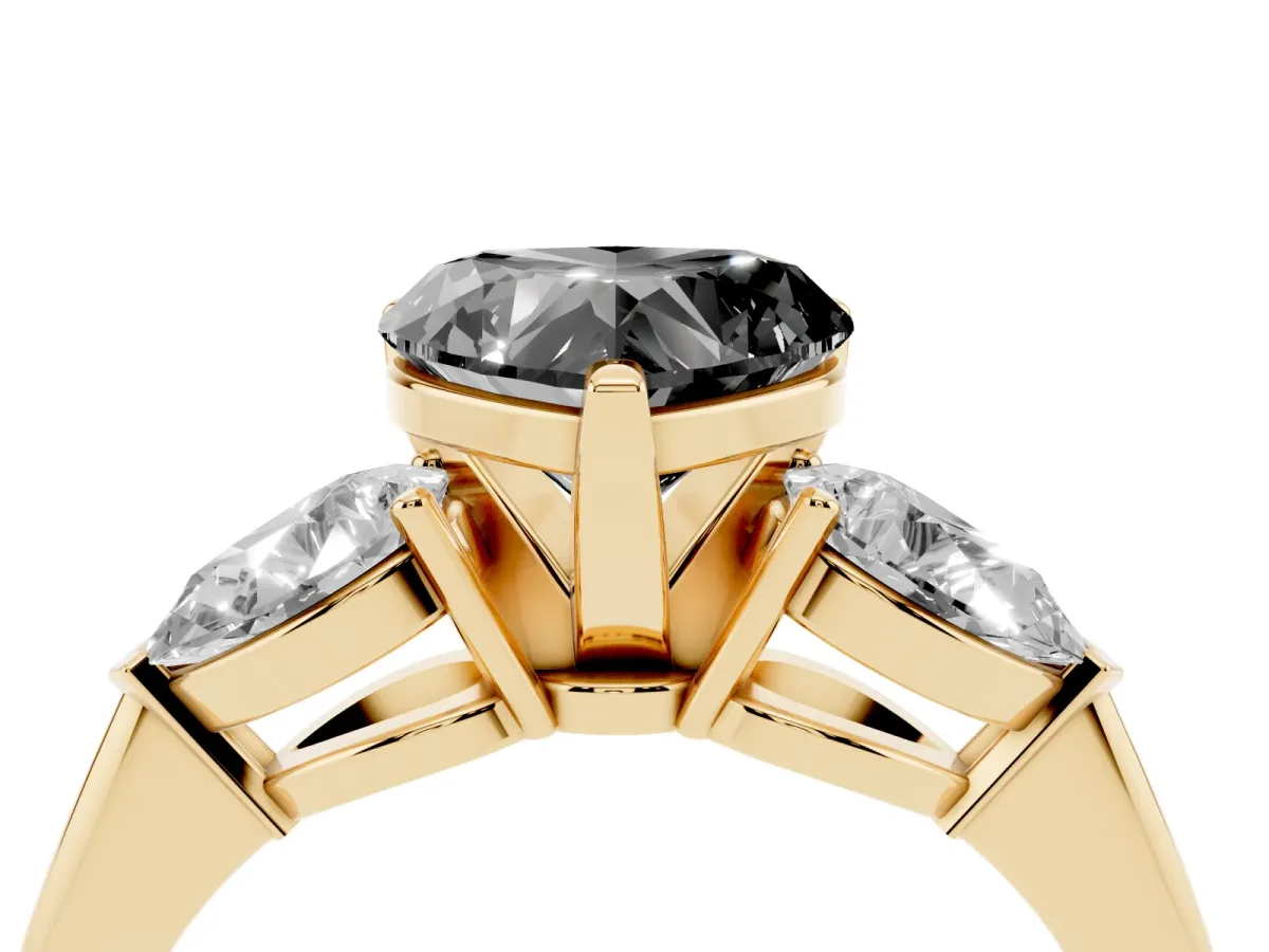 Fancy Black Three-Stone Heart Cut Diamond Ring with Pear Side Stones and Four-Prong Setting Yellow gold
