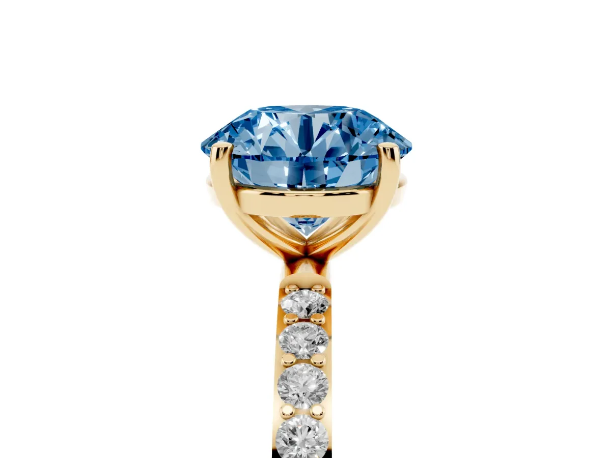 Fancy Blue Round Cut Diamond Solitaire Ring with Round Pavé Shoulders and Prong Setting Yellow gold