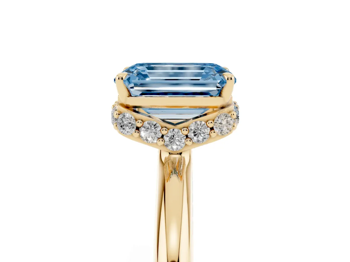 Fancy Blue Emerald Cut Brilliant Solitaire Engagement Ring with Six-Prong Setting and Classic Band Yellow gold