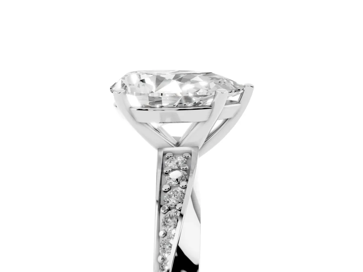 Pear Cut Diamond Engagement Ring with Side Stone Accents and Four-Prong Setting Silver