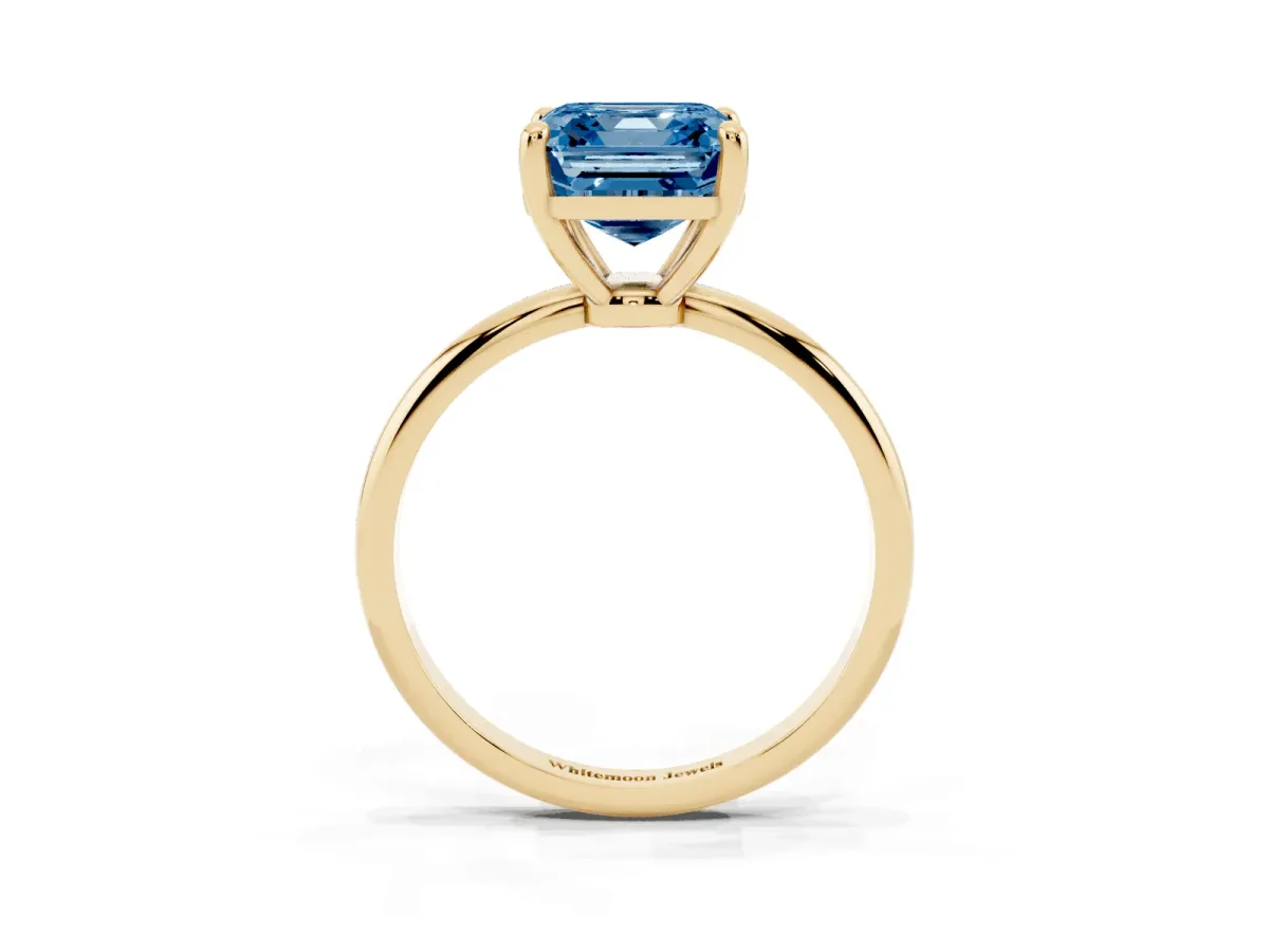 Fancy Blue Asscher Cut Solitaire Diamond Ring with 4-Prong Setting on a Classic Band Yellow gold