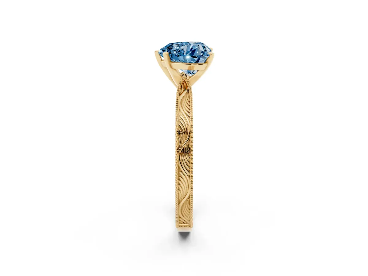 Fancy Blue Heart Cut Solitaire Milgrain Engraved Band with Four-Prong Setting Yellow gold