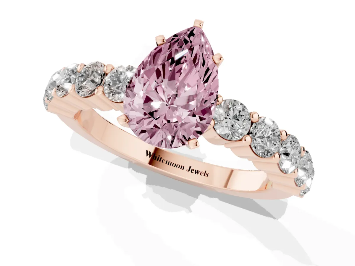 Fancy Pink Pear Cut Diamond Solitaire Ring with Shared Prong Round Side Stones Rose gold