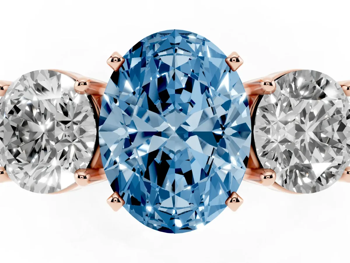 Fancy Blue Three-Stone Oval Cut Diamond Ring with Round Side Stones, Classic Band, and Four-Prong Setting Rose gold