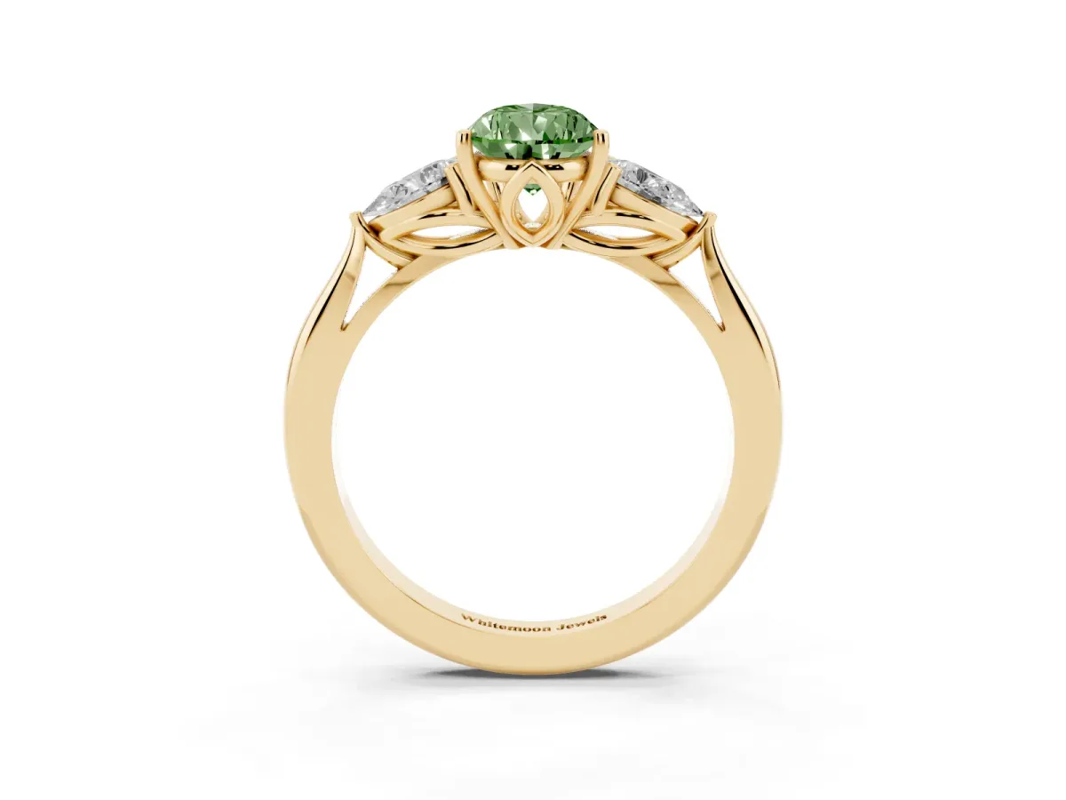 Fancy Green Three-Stone Pear Cut Diamond Ring with Pear Side Stones in Four-Prong Setting Yellow gold