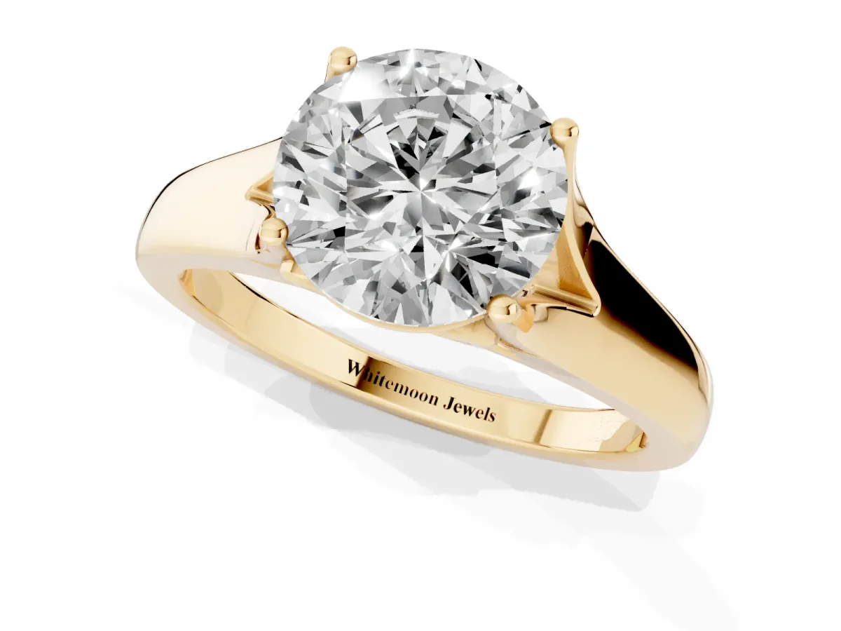 Round Cut Solitaire Diamond Ring with Cathedral Band and Four-Prong Setting Yellow gold