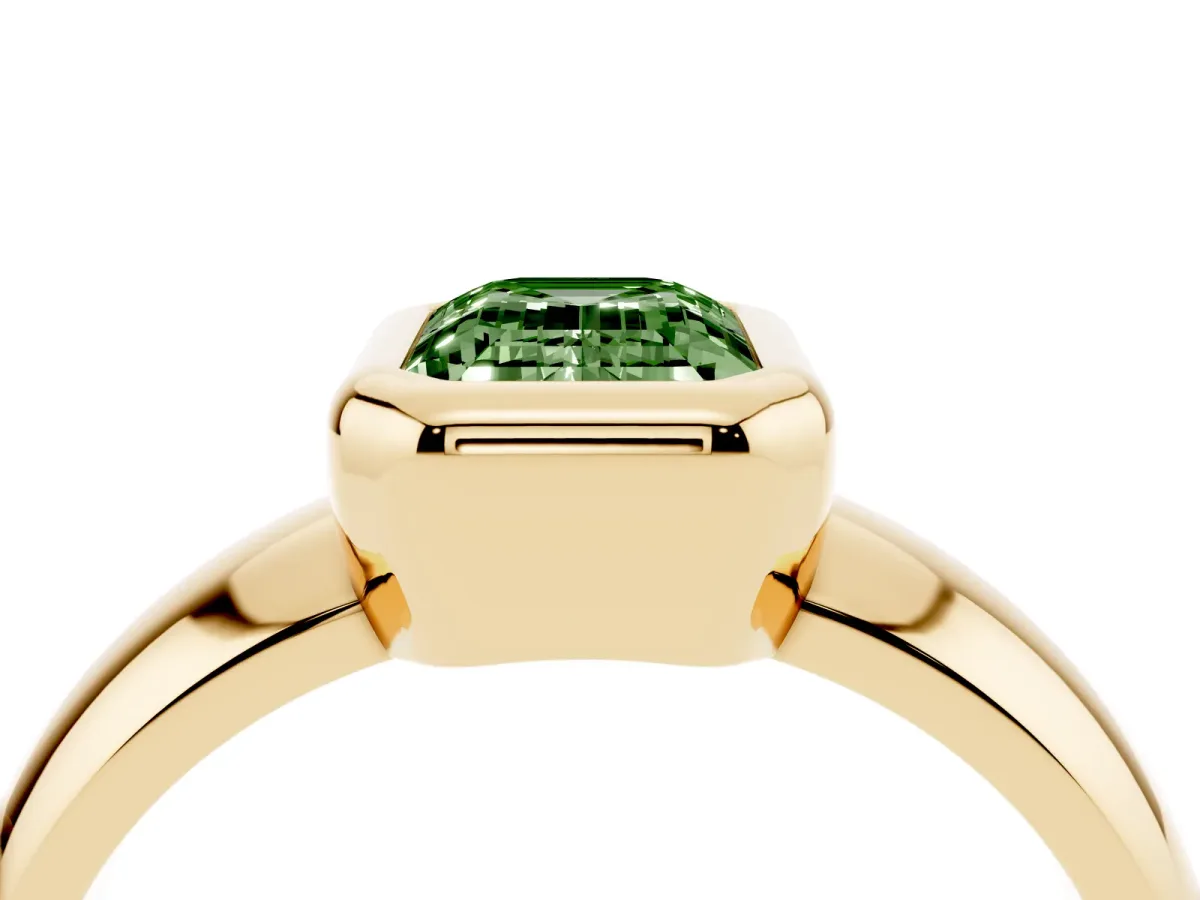 Fancy Green Bezel Set Emerald Cut Solitaire Ring with Wide Band Yellow gold