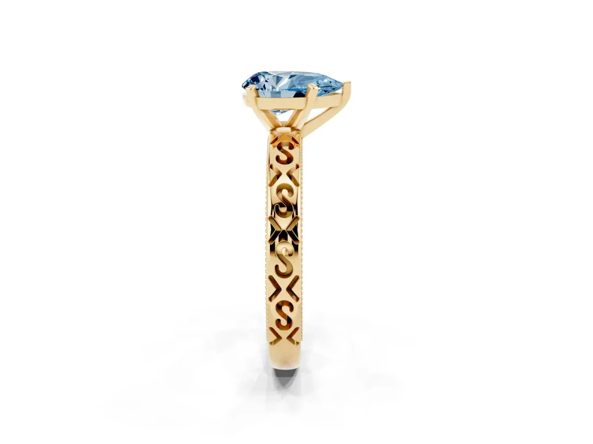 Fancy Blue Pear Cut Solitaire Engagement Ring with Scrollwork Band and Four-Prong Setting Yellow gold