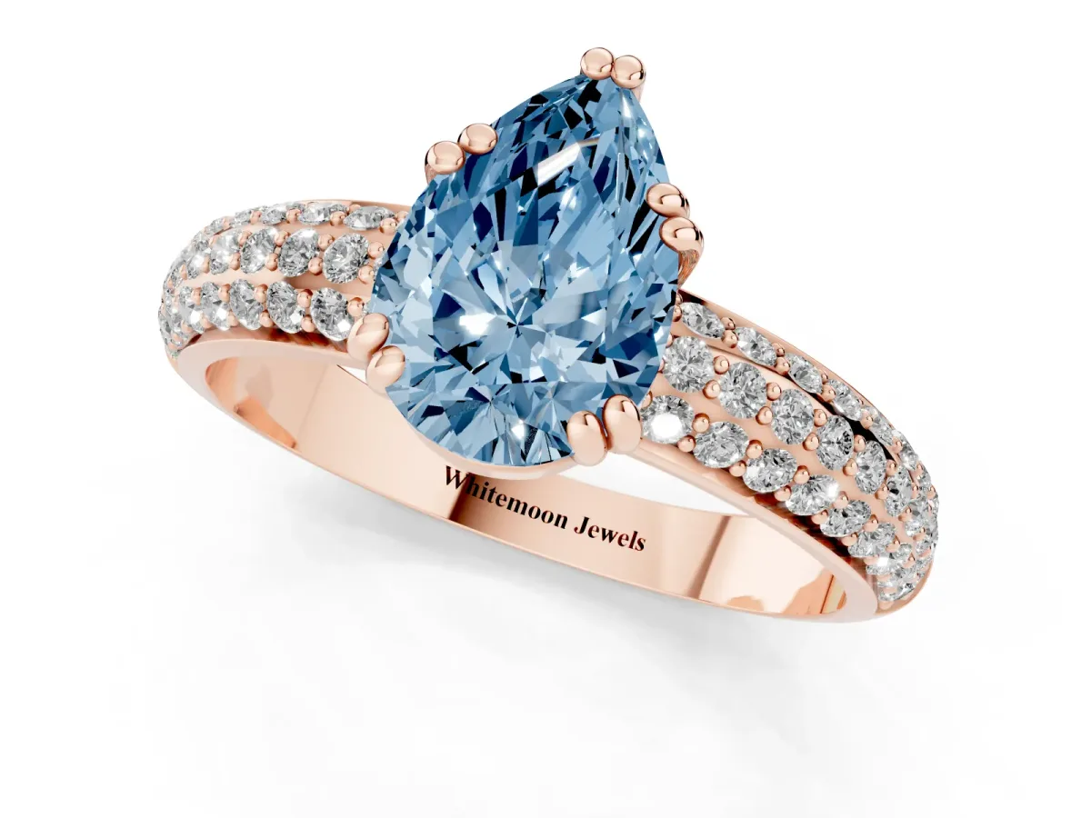 Fancy Blue Pear Cut Diamond Solitaire Ring with Multi-Row Round Pavé Band and Prong Setting Rose gold