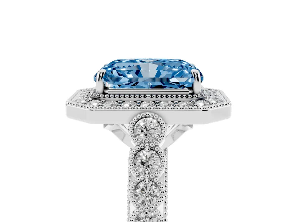Fancy Blue Radiant Cut Halo Milgrain Solitaire with Bezel Set Side Stones and Pave Band White gold