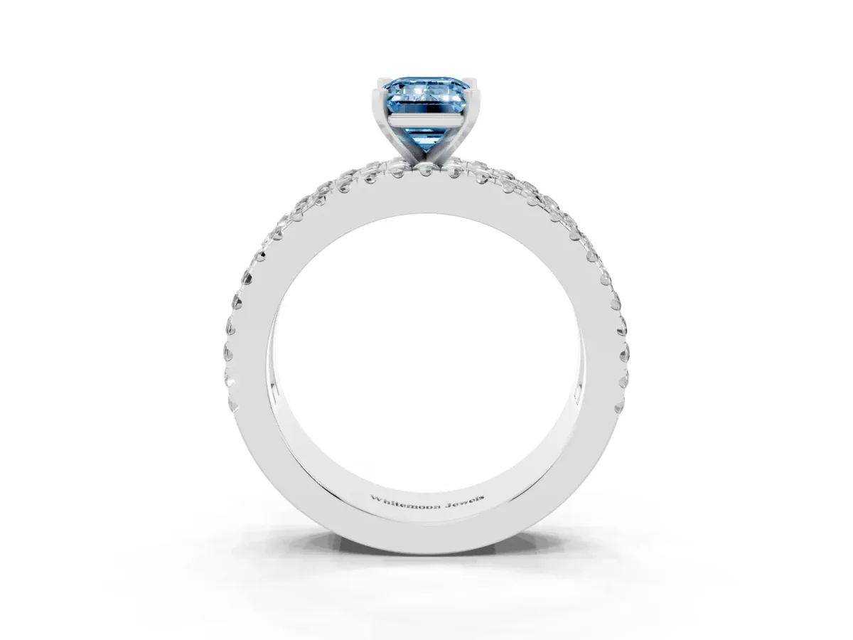 Fancy Blue Emerald Cut Diamond Solitaire Ring with Pavé and Channel Set Band Platinum