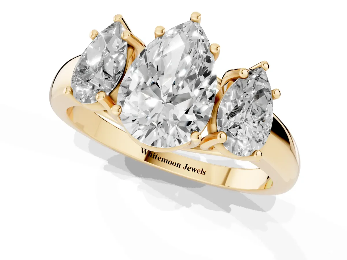 Three-Stone Pear Cut Diamond Engagement Ring with Prong Setting Yellow gold