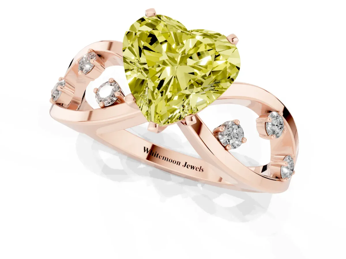 Fancy Yellow Heart Cut Cut Solitaire Diamond with Side Stones on Criss-Cross Band and Four-Prong Setting Rose gold