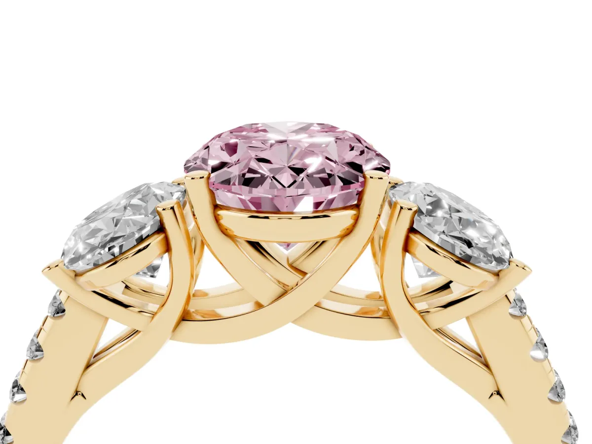 Fancy Pink Three-Stone Oval Cut Diamond Ring with Round Pavé Band and Prong Setting Yellow gold