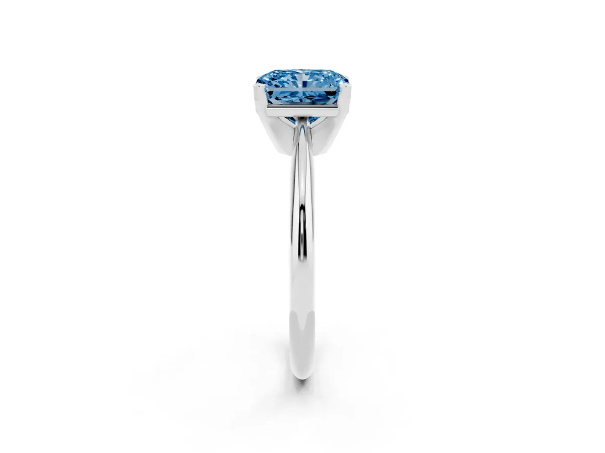 Fancy Blue Radiant Cut Cut Solitaire Ring with Four-Prong Setting on a Classic Band Silver
