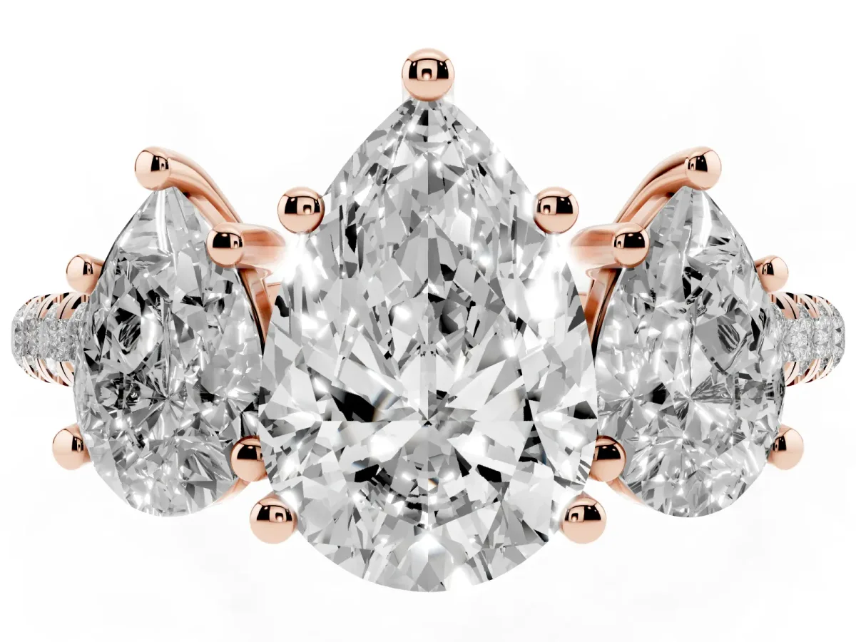 Three-Stone Pear Cut Diamond Ring with Round Pavé Band and Prong Setting Rose gold