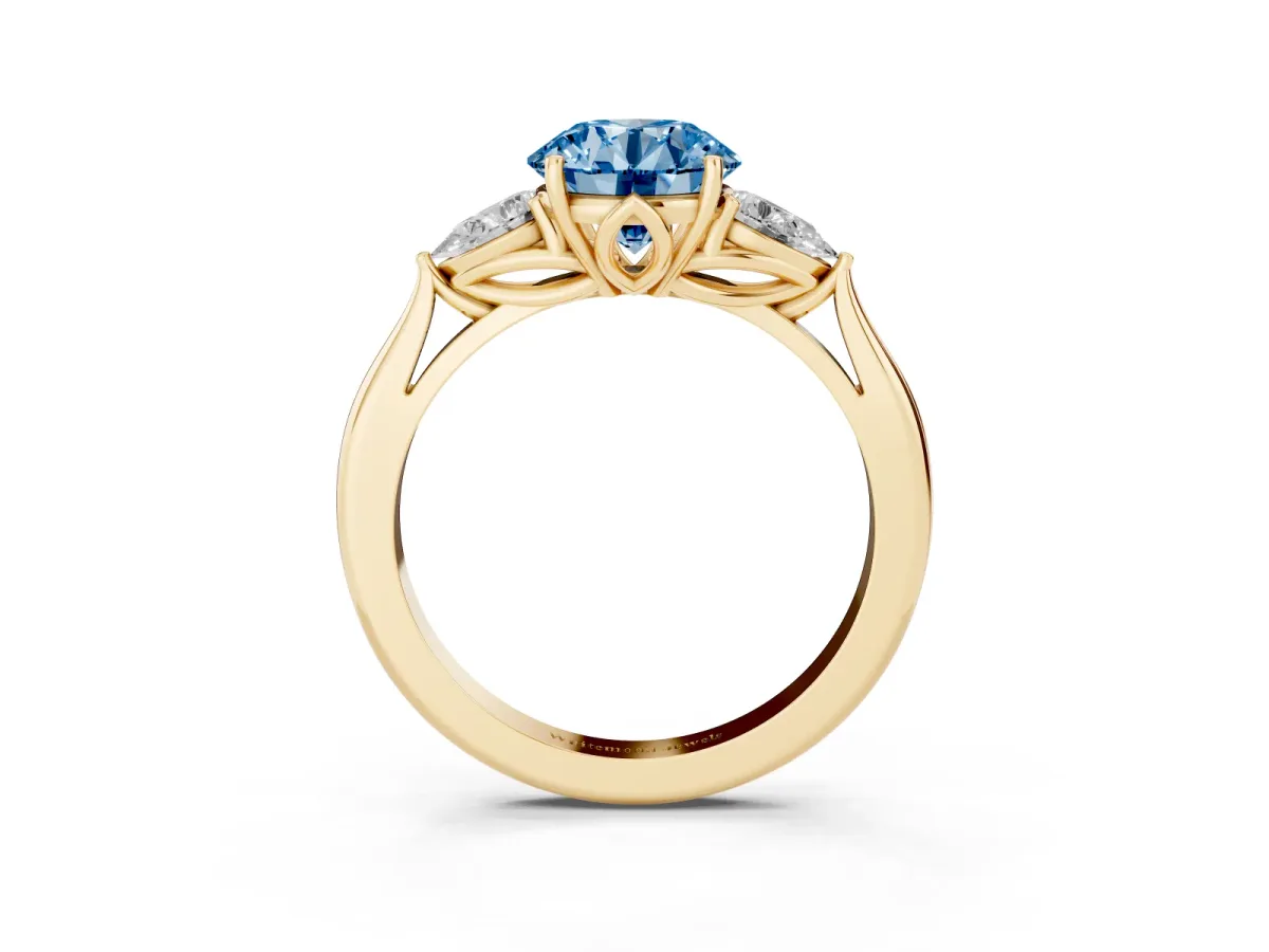 Fancy Blue Three-Stone Round Cut Brilliant Diamond Solitaire Ring with Tapered Band and Four-Prong Setting Yellow gold
