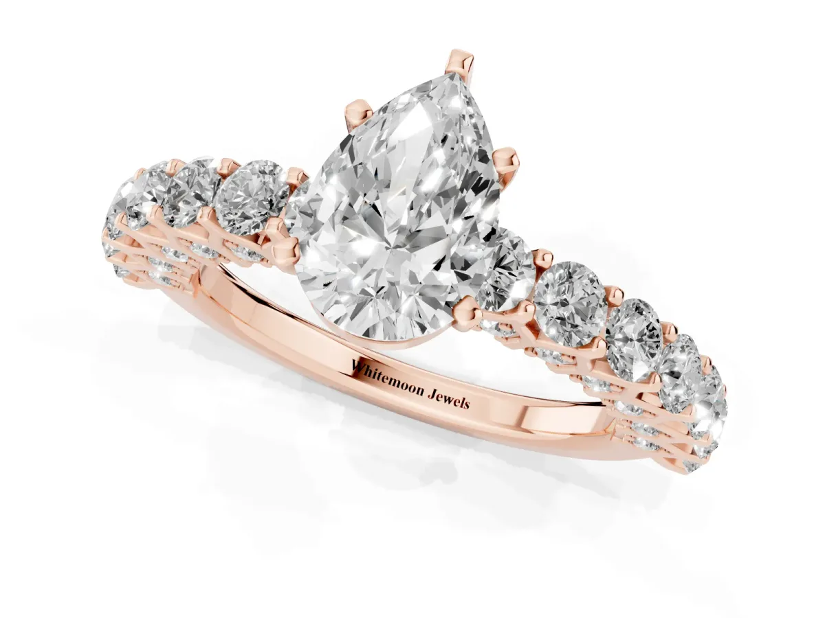 Pear Cut Diamond Solitaire Ring with Shared Prong Pavé Band and Four-Prong Setting Rose gold