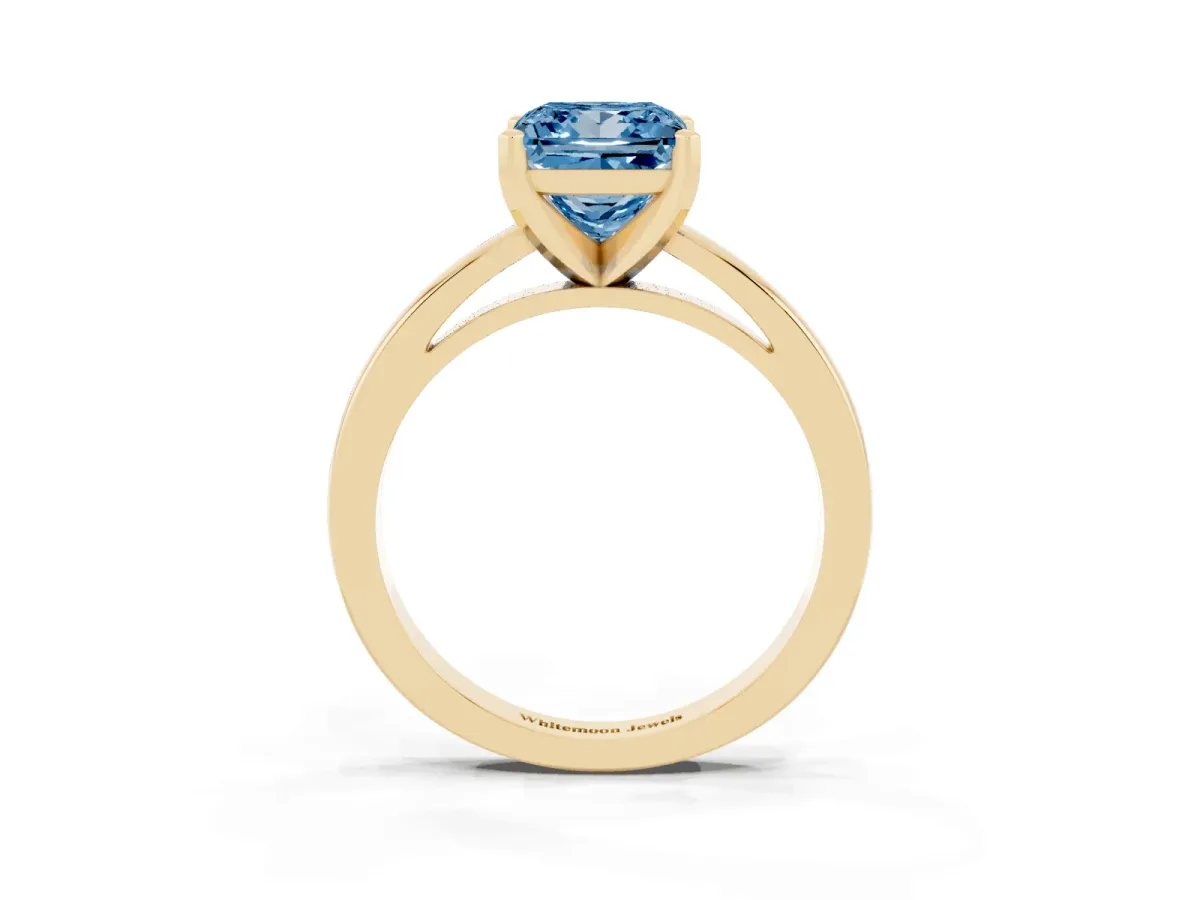 Fancy Blue Princess Cut Solitaire Diamond Engagement Ring with Four-Prong Setting on a Classic Band Yellow gold