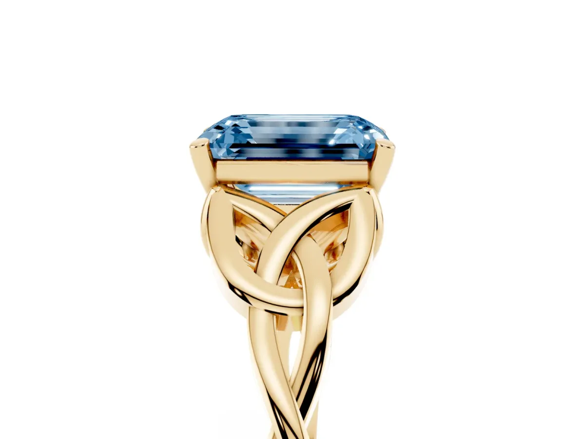 Fancy Blue Emerald Cut Diamond Solitaire Engagement Ring with Celtic Knot Band and Four-Prong Setting Yellow gold