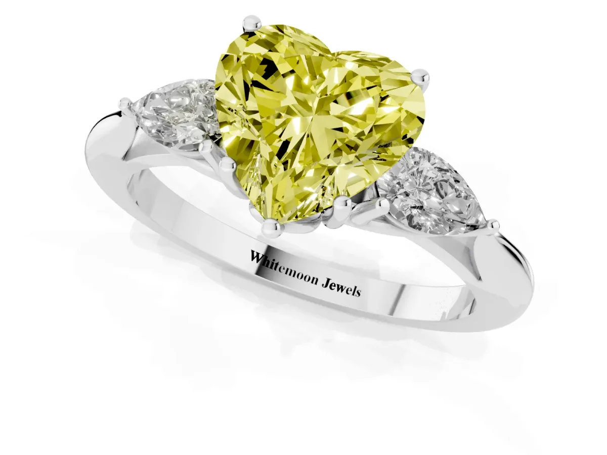 Fancy Yellow Three-Stone Heart Cut Brilliant Diamond Solitaire Ring with Tapered Band and Four-Prong Setting Silver