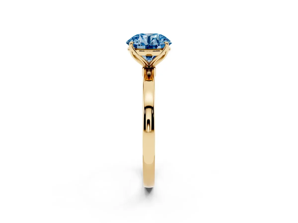Fancy Blue Round Cut Diamond Solitaire Ring with Thin Band and Prong Setting Yellow gold