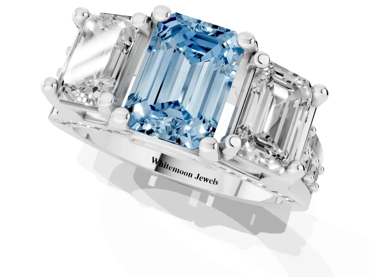 Fancy Blue Emerald Cut Diamond Three-Stone Ring with Channel Set Band and Four-Prong Setting Silver