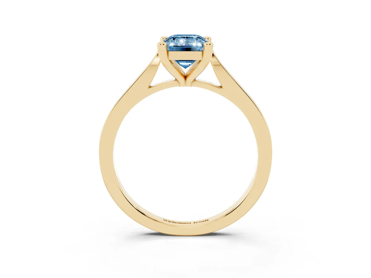 Fancy Blue Emerald Cut Solitaire Diamond Ring with Four-Prong Setting and Tapered Band Yellow gold