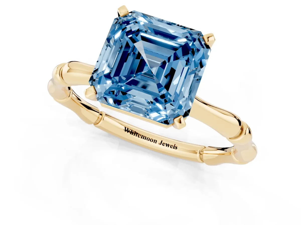 Fancy Blue Asscher Cut Solitaire Diamond Ring with Bamboo Band and Four-Prong Setting Yellow gold