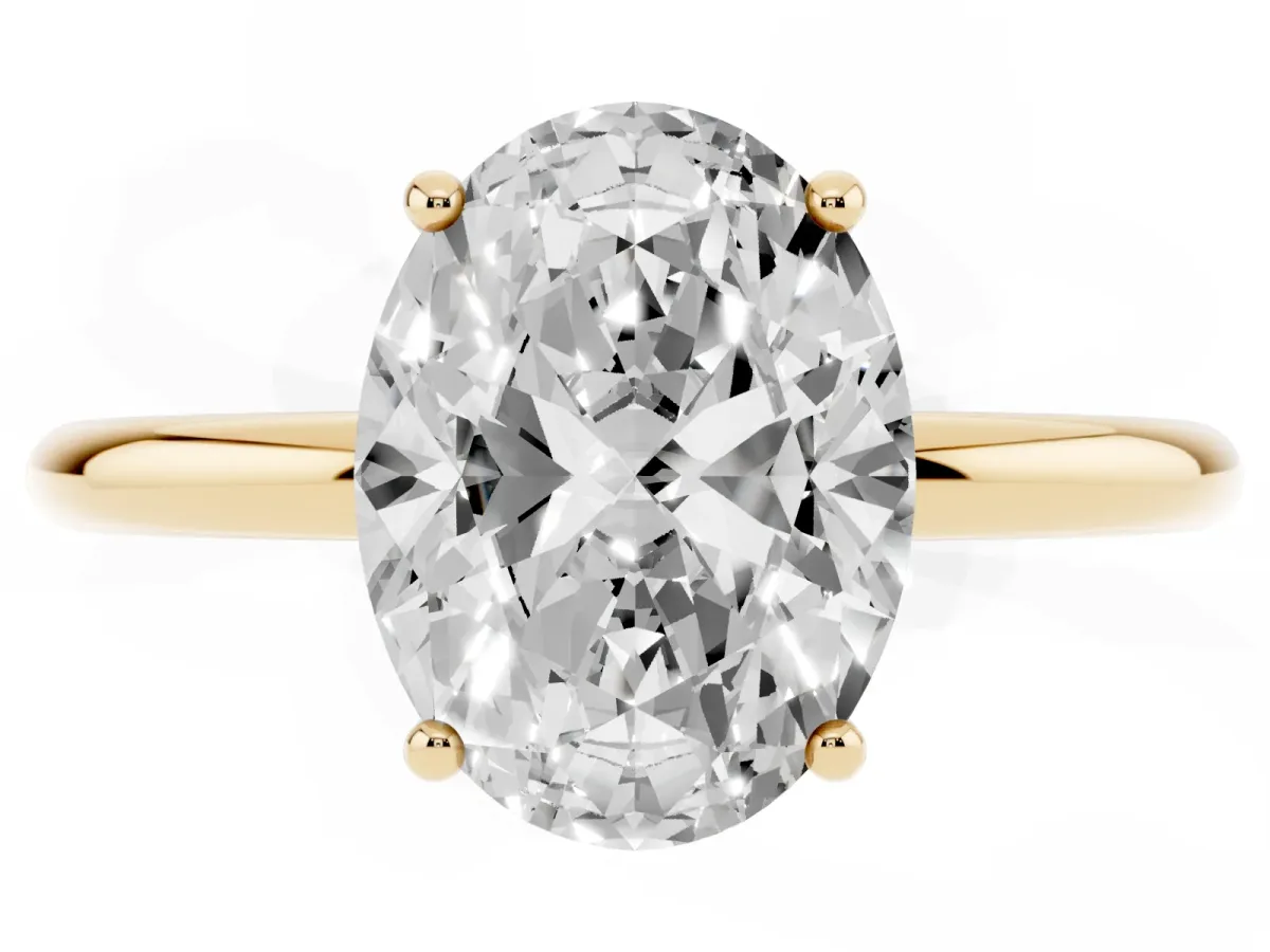 Oval Cut Solitaire Diamond Ring with a Classic Band and Four-Prong Setting Yellow gold