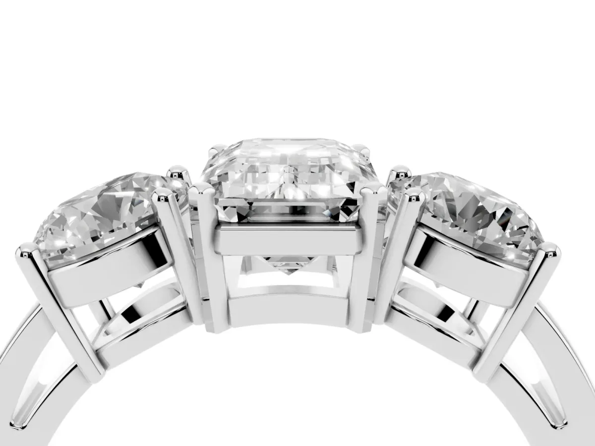 Three-Stone Emerald Cut Diamond Ring with Round Side Stones, Classic Band, and Four-Prong Setting Silver