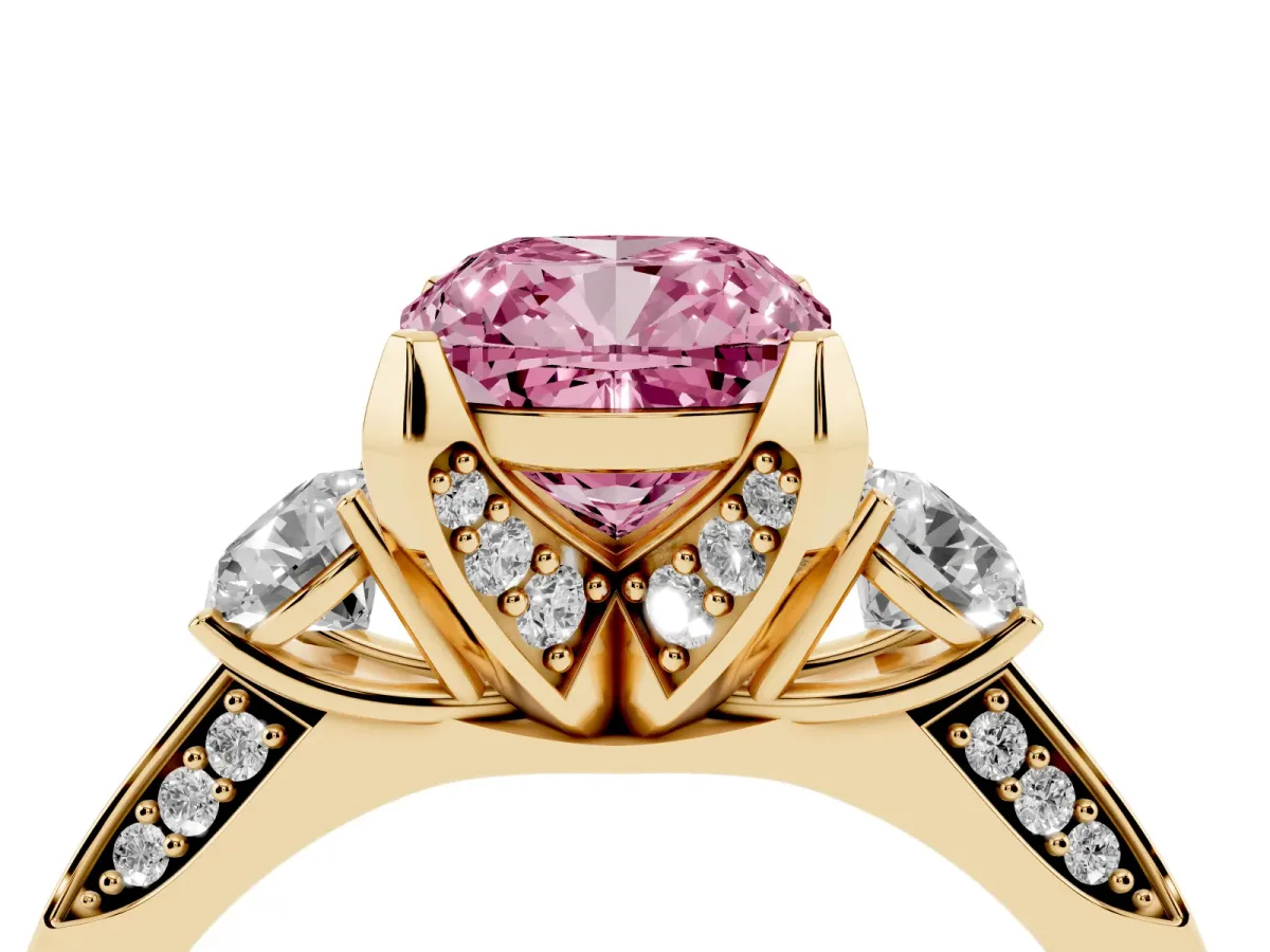 Fancy Pink Cushion Cut Brilliant Three-Stone Diamond Ring with Pavé Band and Four-Prong Setting Yellow gold