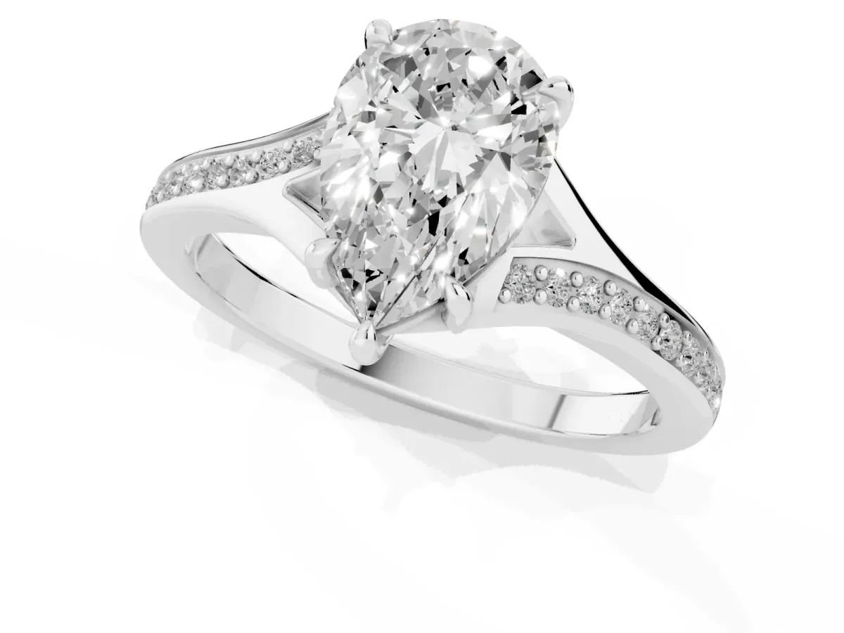 Pear Cut Diamond Solitaire Ring with Pavé Band and Prong Setting Silver