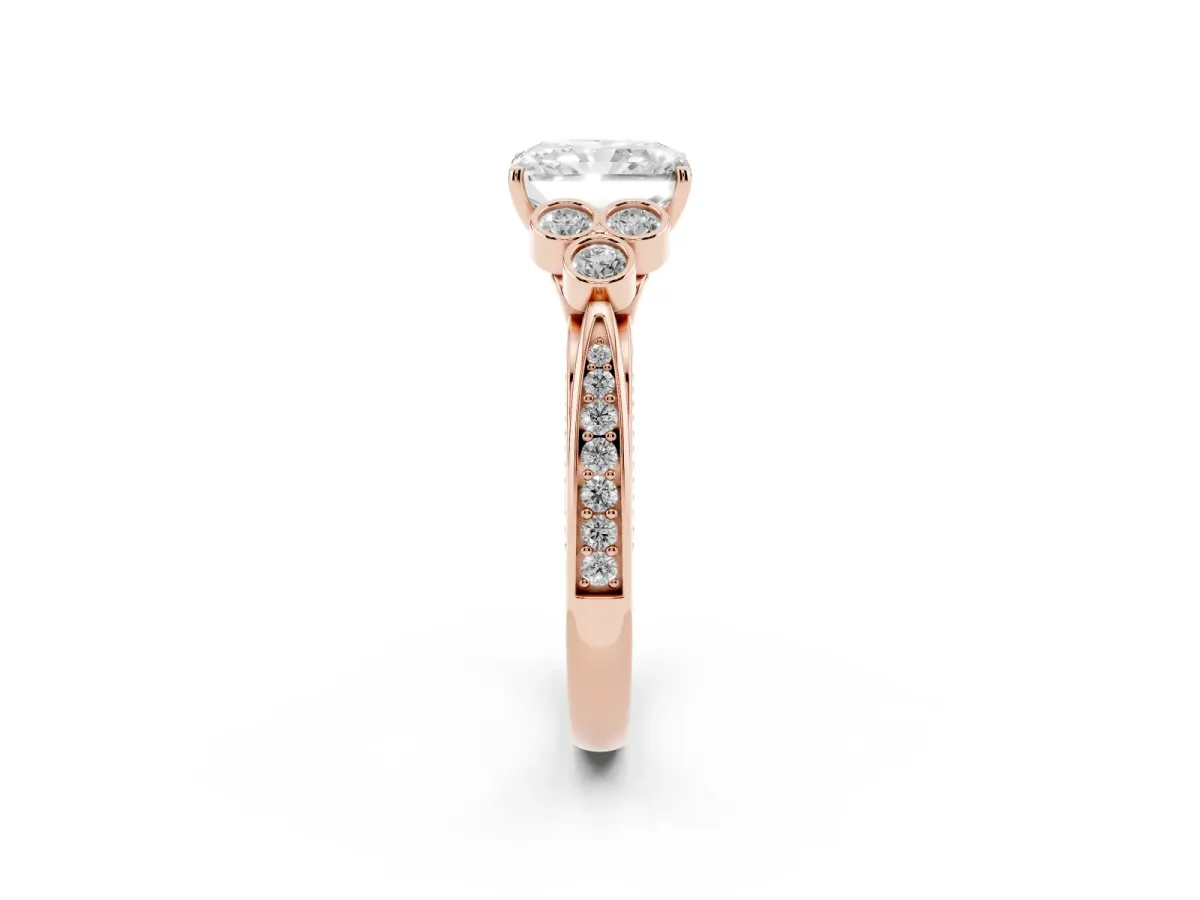Radiant Cut Cut Diamond Engagement Ring with Bezel Set Round Side Stones and Prong Setting Rose gold