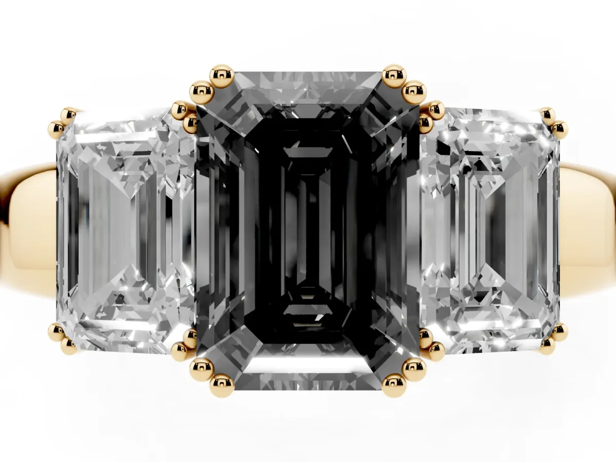 Fancy Black Three-Stone Emerald Cut Cut Diamond Ring with Channel Set Band and Four-Prong Setting Yellow gold