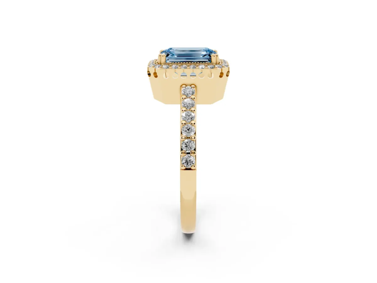 Fancy Blue Emerald Cut Cut Diamond Halo Engagement Ring with Milgrain Detail and Pavé Band Yellow gold