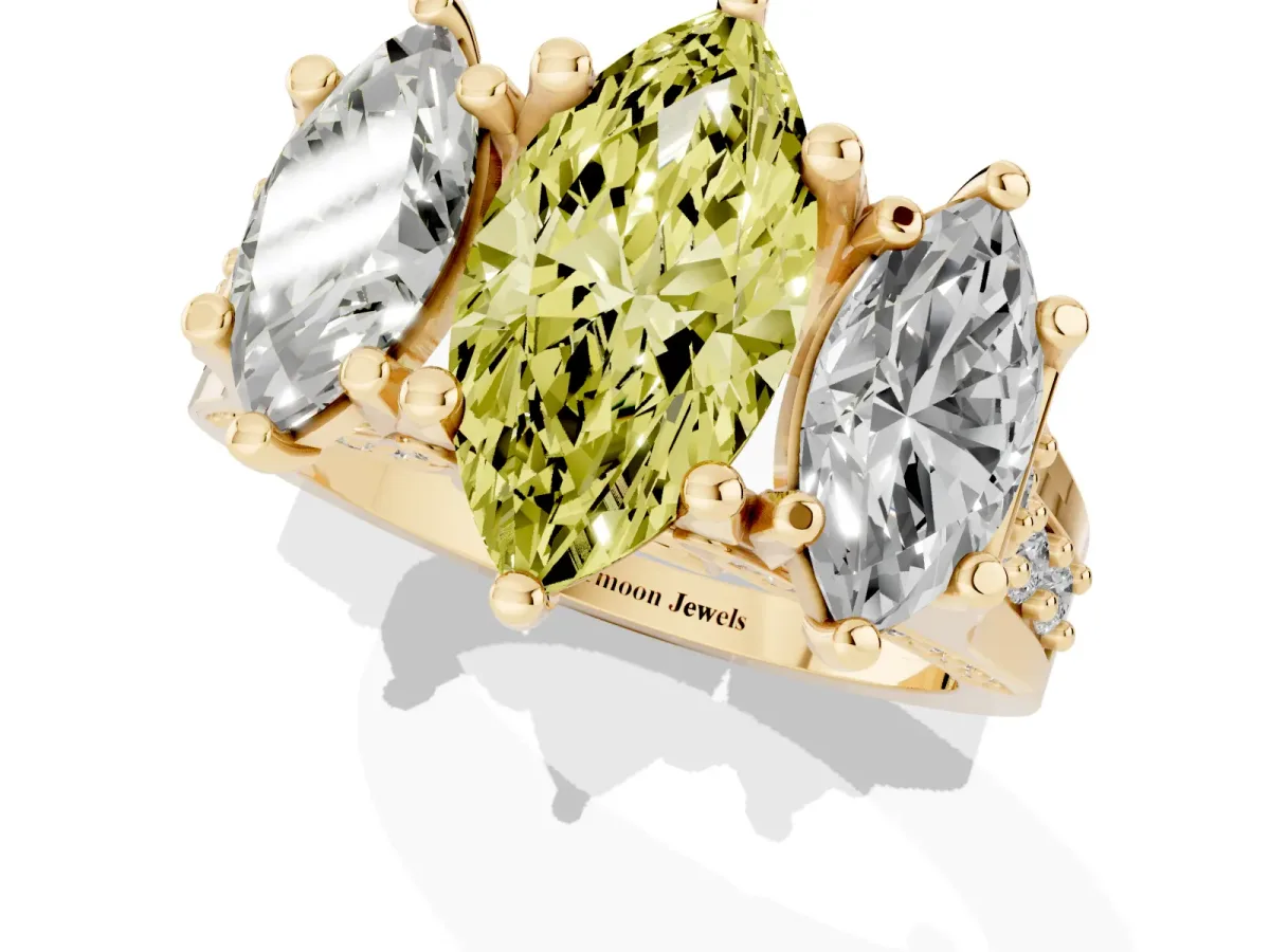 Fancy Yellow Marquise Cut Diamond Three-Stone Ring with Channel Set Band and Four-Prong Setting Yellow gold